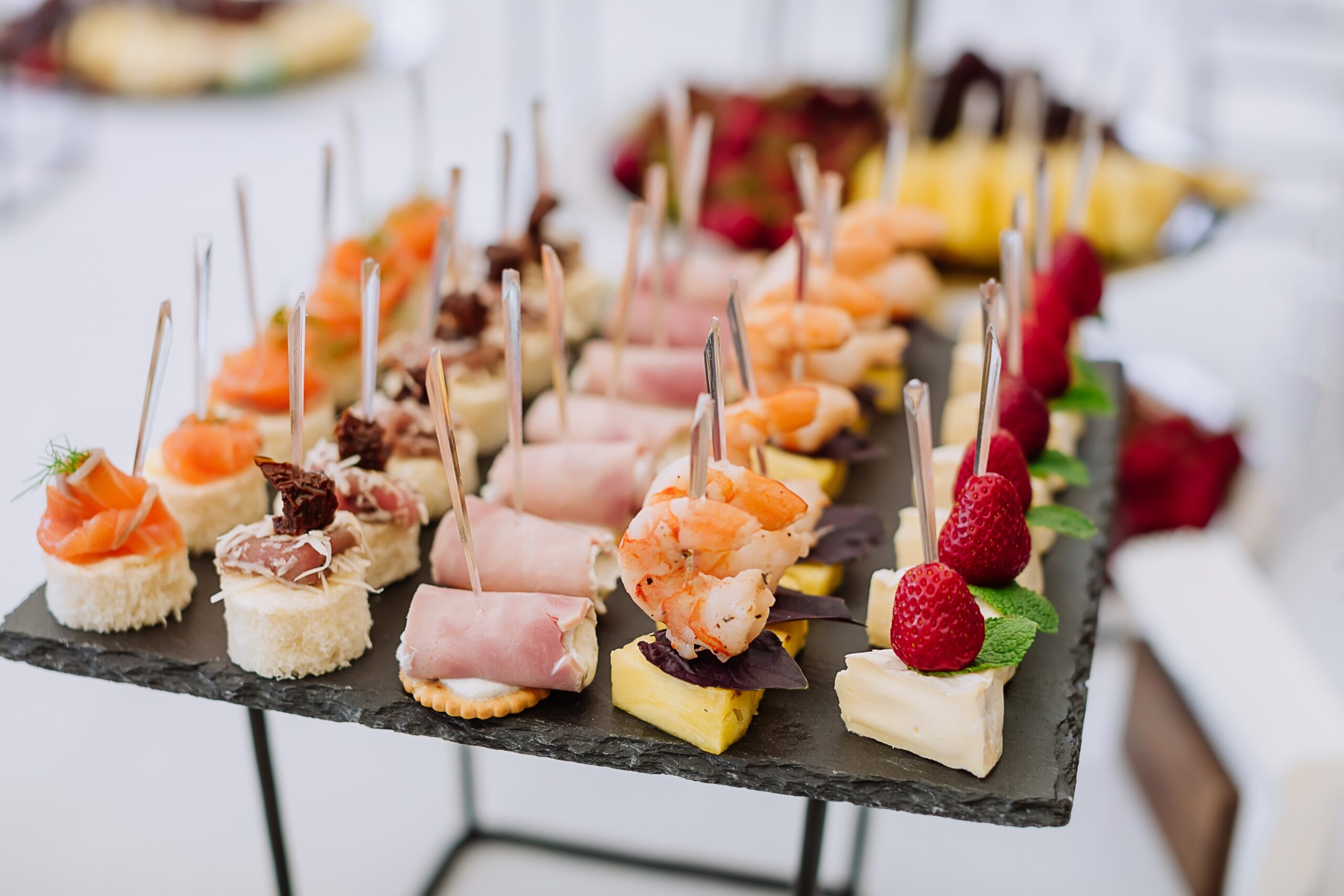 Different light snack on tray at the table on wedding party